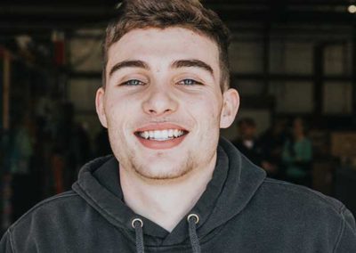 Dylan Burney - Younger fellow with a nice smile and blue eyes. He has shortish curly hair on top and short on sides. Slight beard.