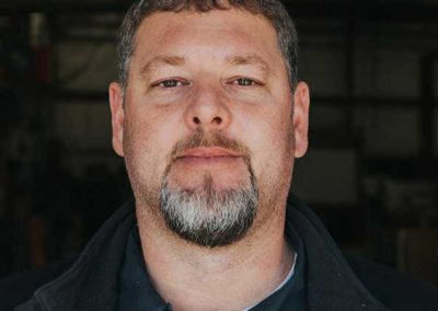 Jason Tucker - Short hair with brown mustache and graying goatee.