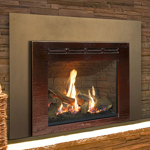 dark red gas fireplace insert with fire burning in it irregular brick hearth