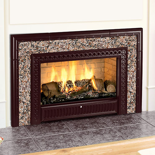 firewood burning in fireplace insert with stone hearth and reddish brown framing